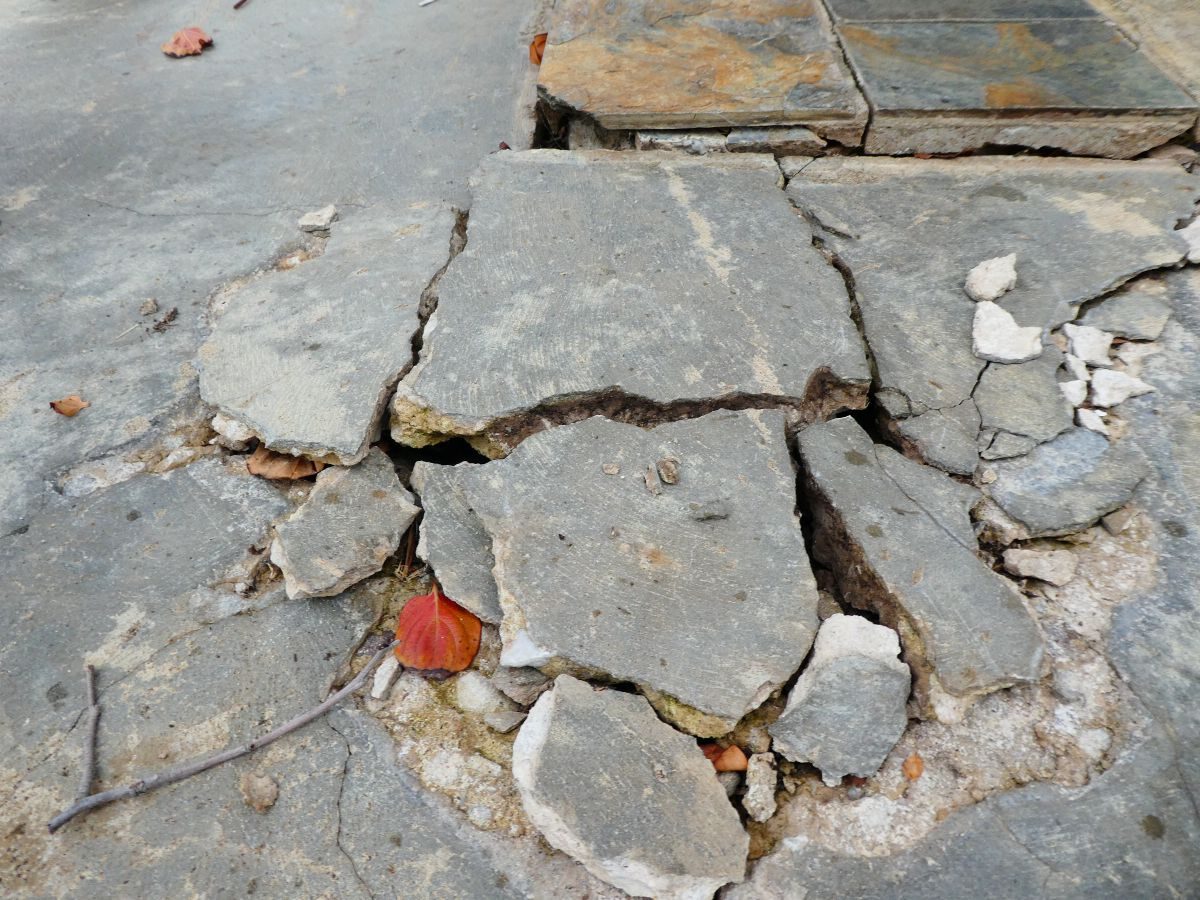 Broken slate paving during a structural investigation at Magill