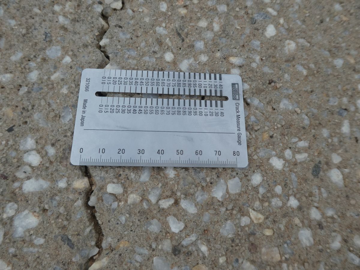 Crack gauge on a cracked concrete driveway at Roseworthy