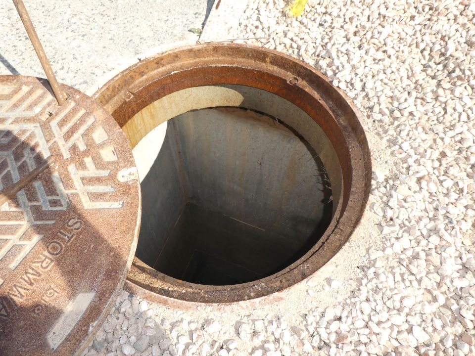 Open council stormwater manhole during a site inspection at Port Hughes