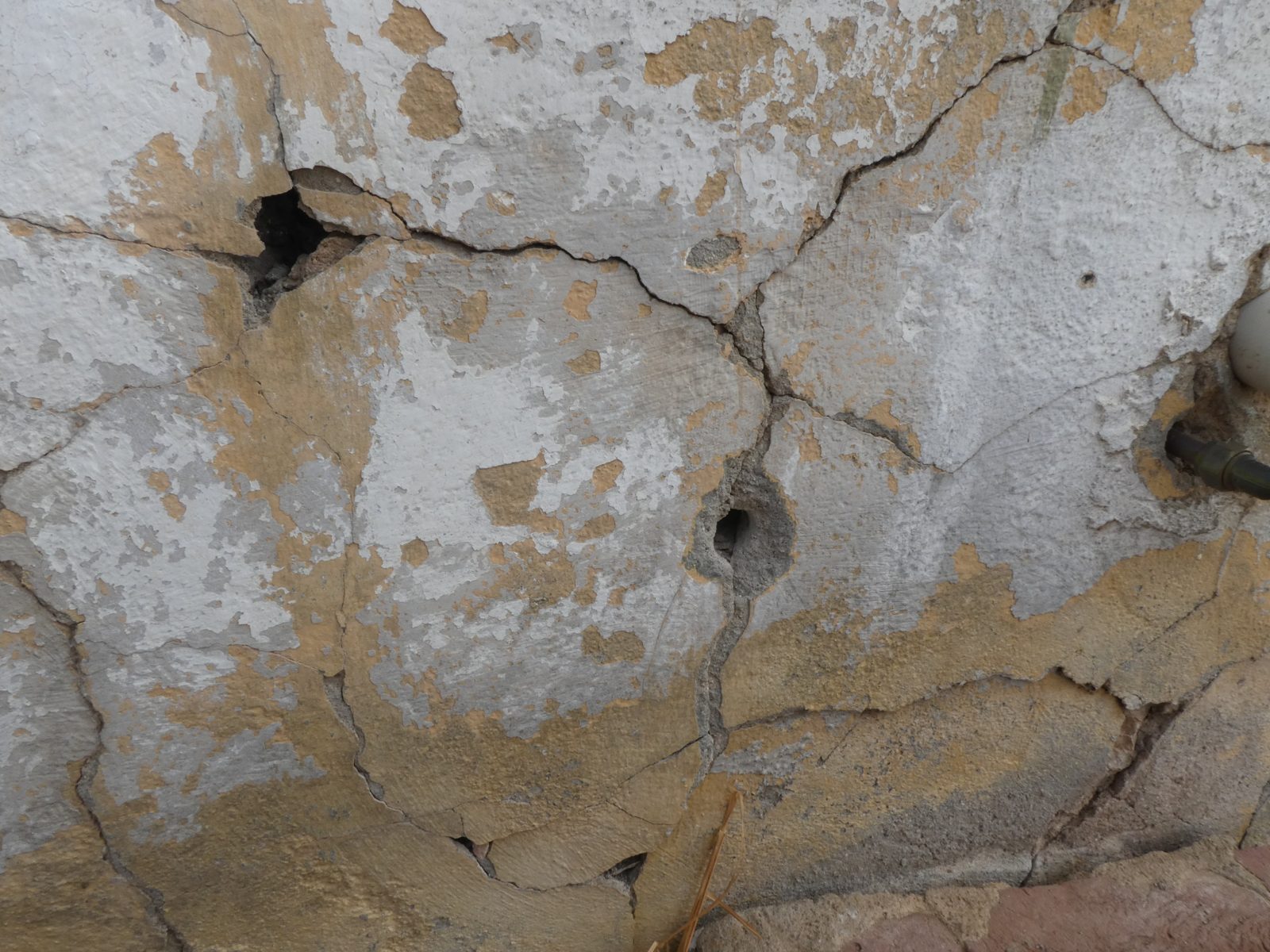 Cracked and spalling render on masonry at Wallaroo Mines