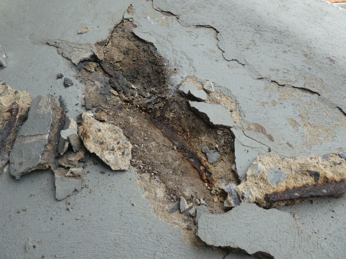 Spalled concrete and rusted steel on a balcony at West Lakes